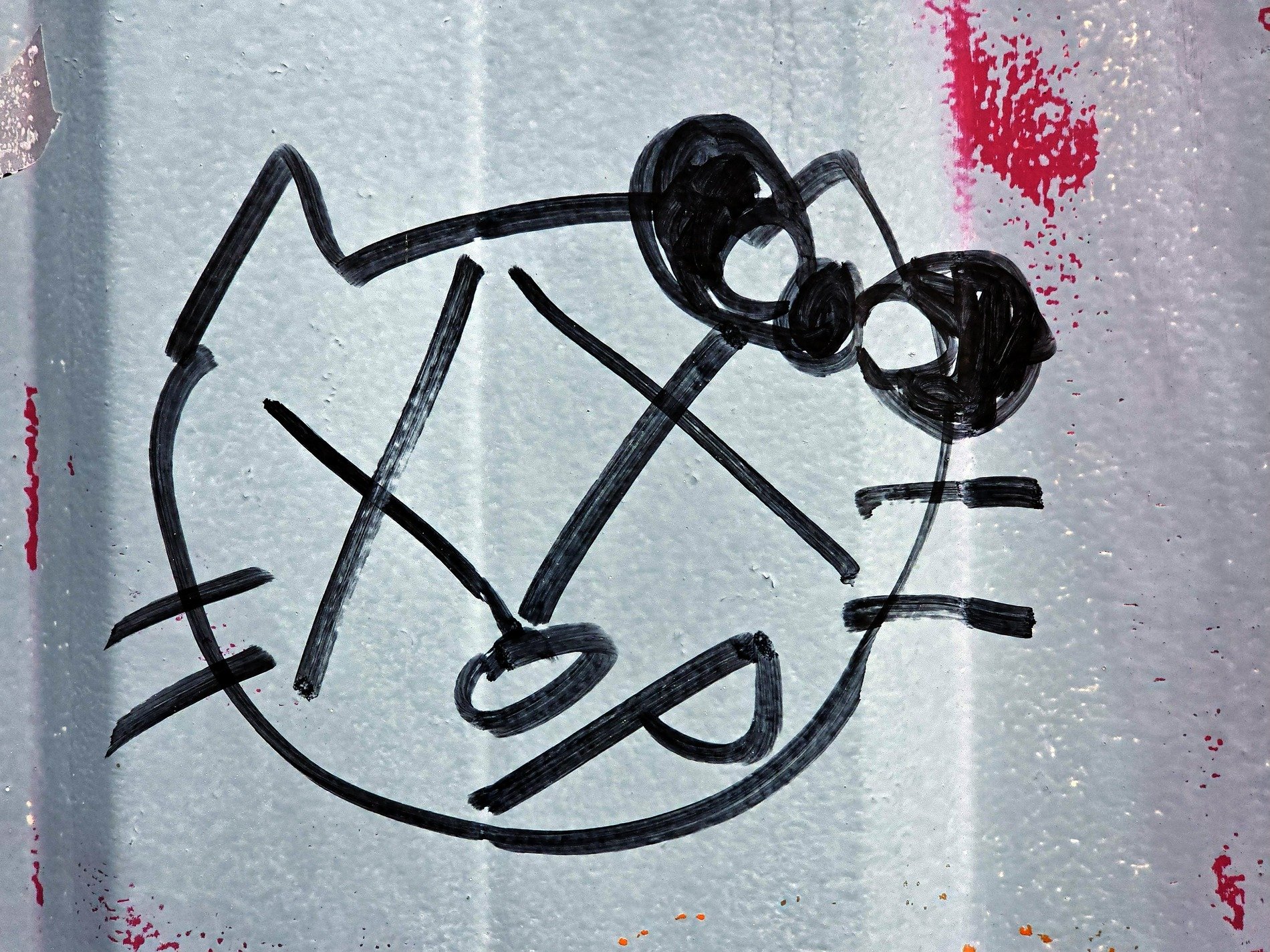 Black ink on the blue, sharp lines mark the metal skin, pink mist fades away