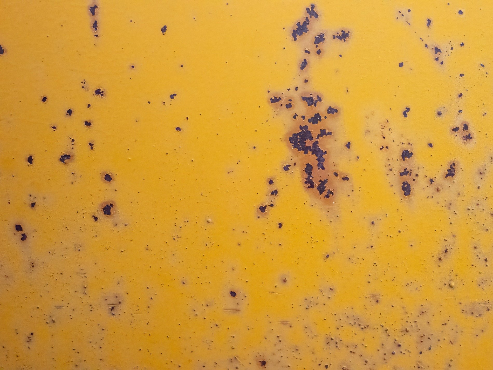 Blue fields meet the grey, heavy marks trace the surface, time wears the finish