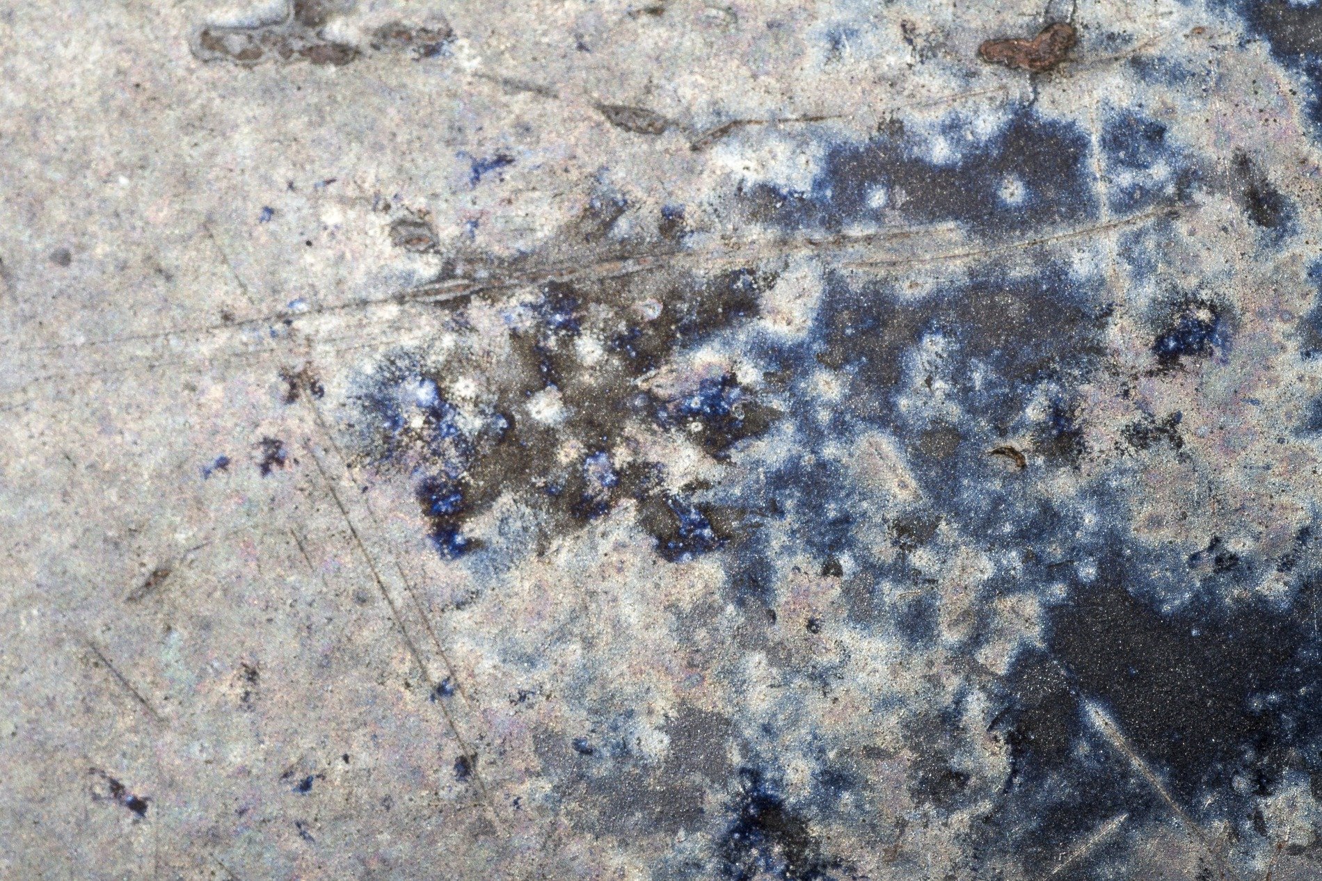 Steel wears deep indigo, silver dust meets dark shadows, heat leaves silent marks