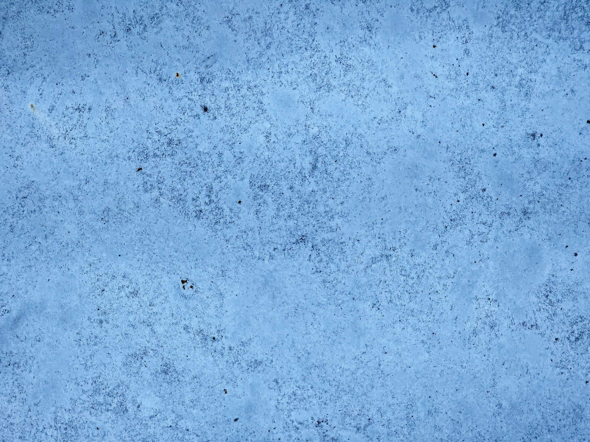 Blue flakes drift away, white layers show underneath, time wears down the skin