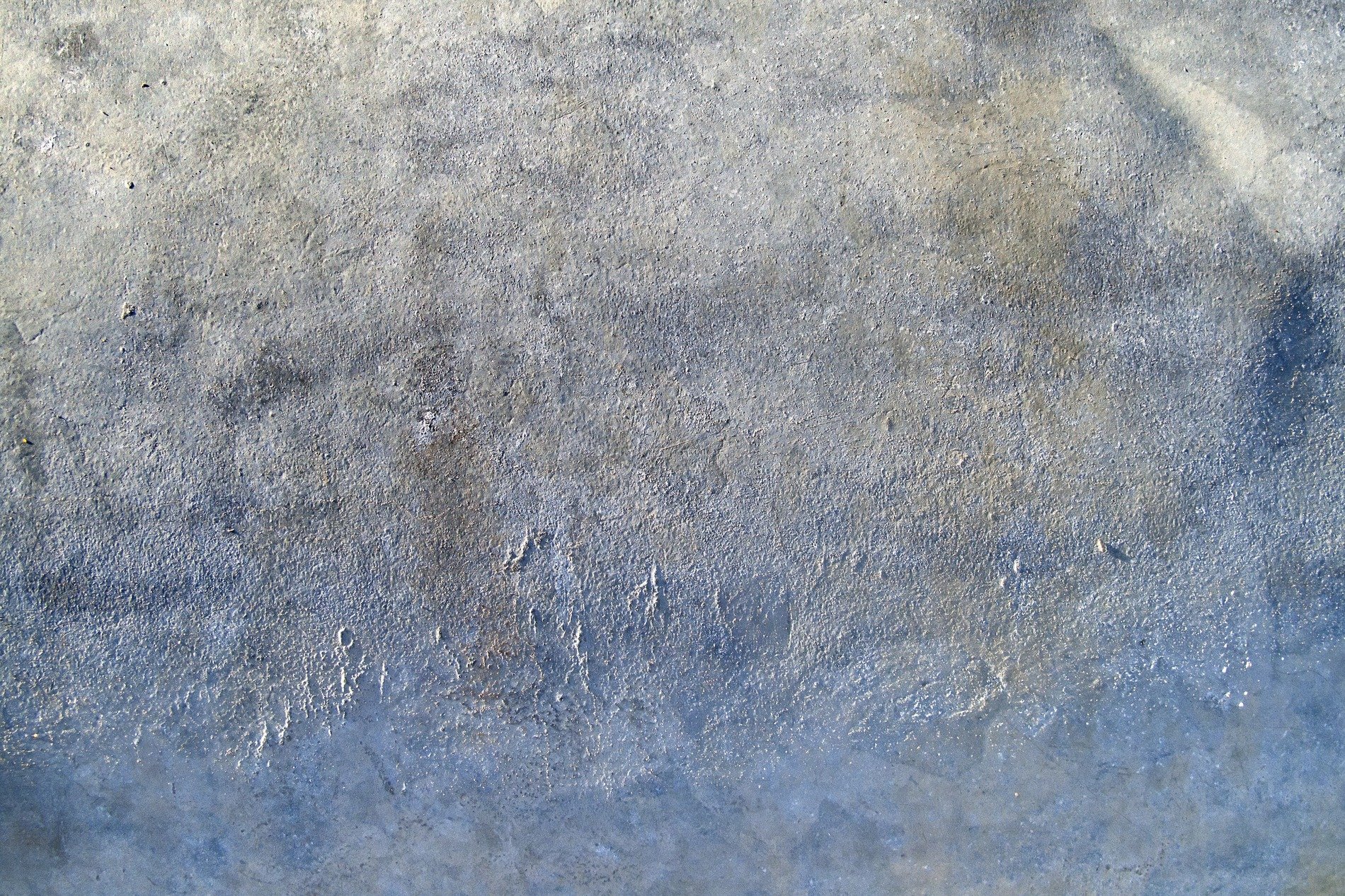 Blue islands remain, orange rust blooms on the steel, time wears the finish