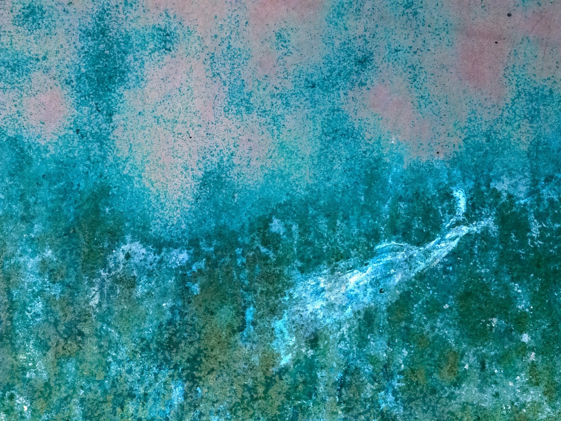 Blue layers peel back, jagged marks trace the field, light catches the edge