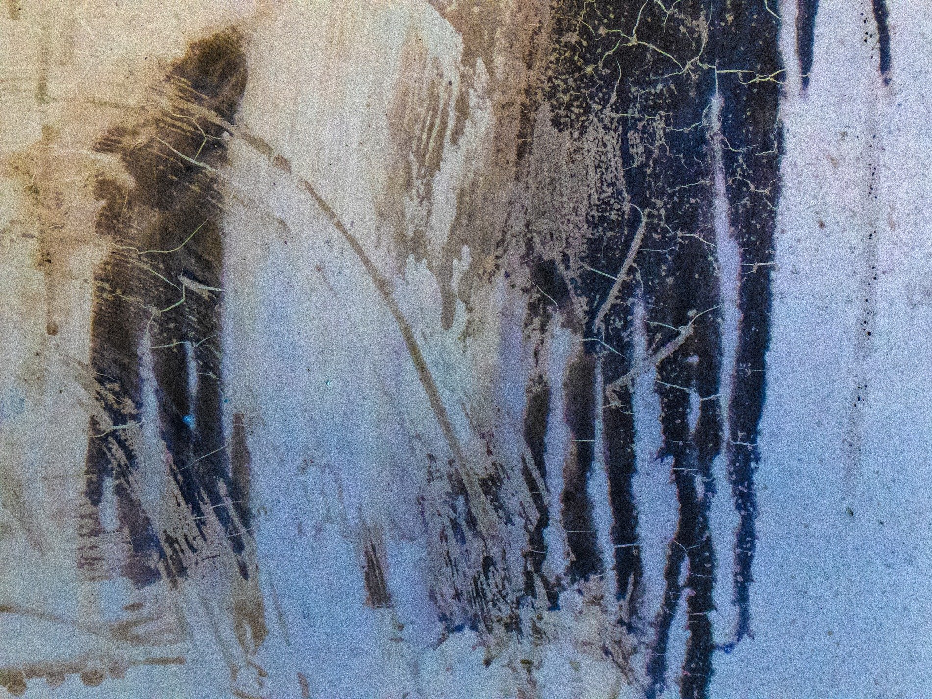 Blue skin flaking fast, jagged edges meet the light, grit marks the clear field