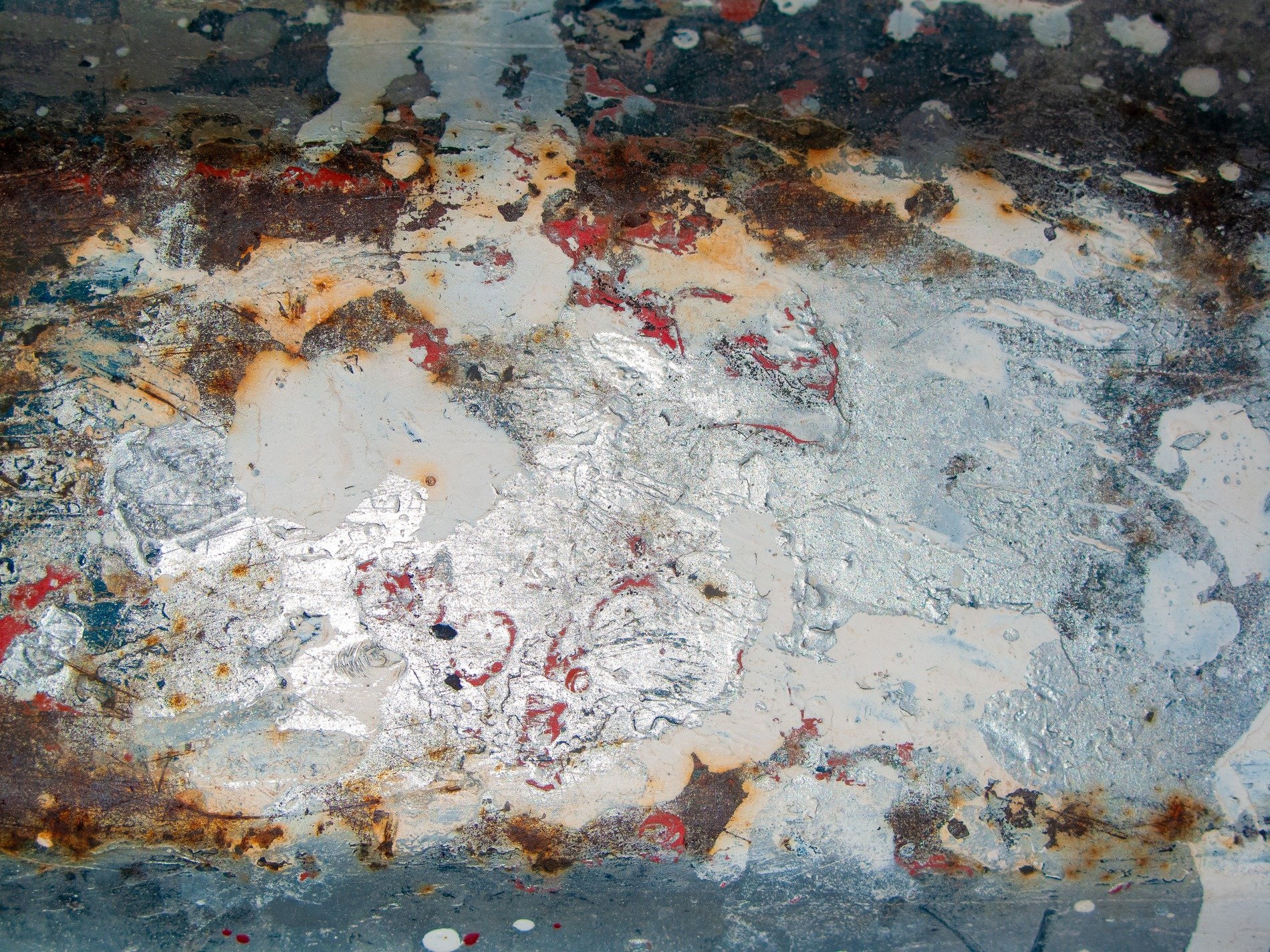 Blue strips meet the grey, organic spots bloom on the skin, grit holds the growth