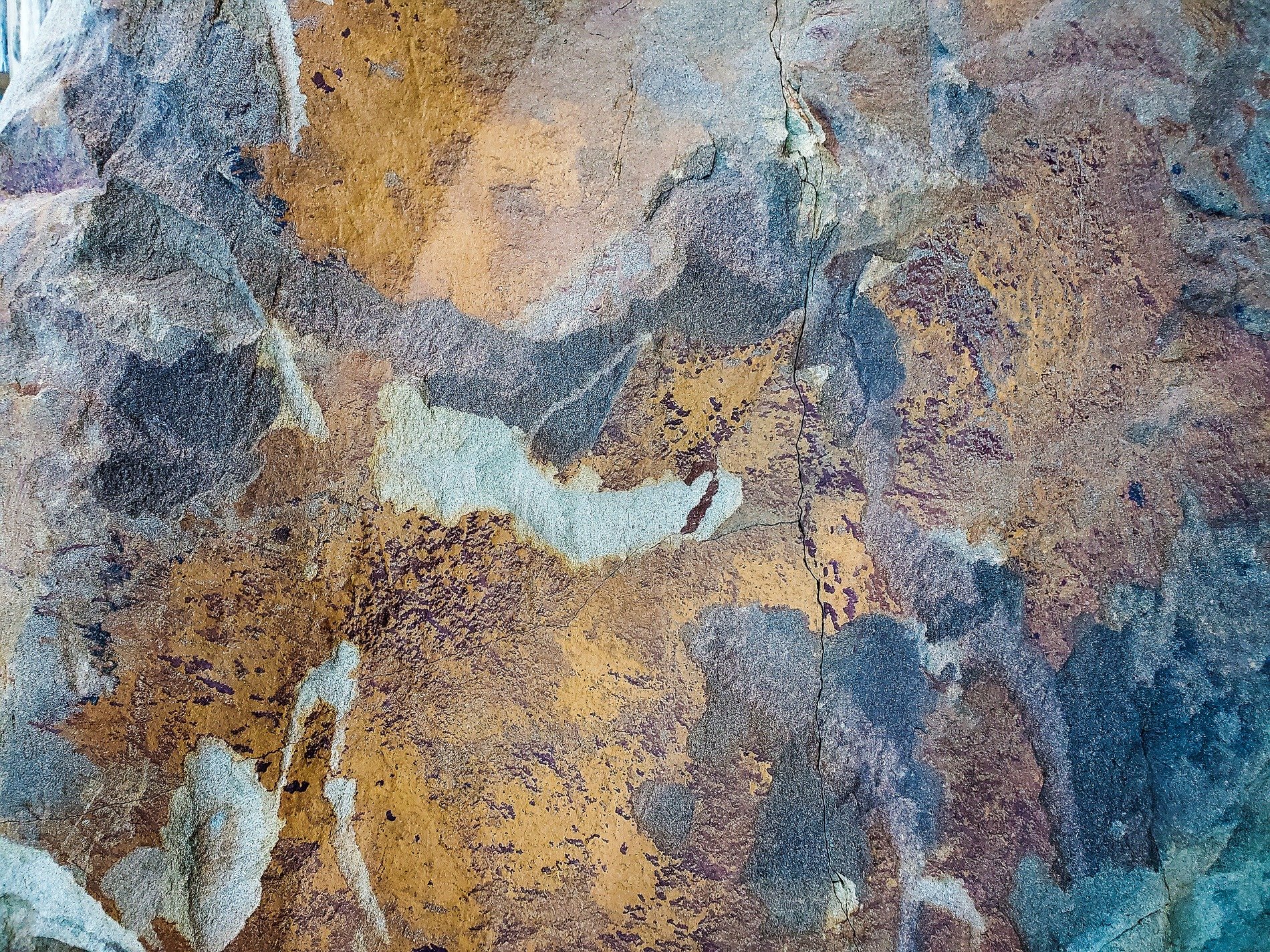 Bright curves twist in light, mineral grains hold the field, jagged forms meet the edge