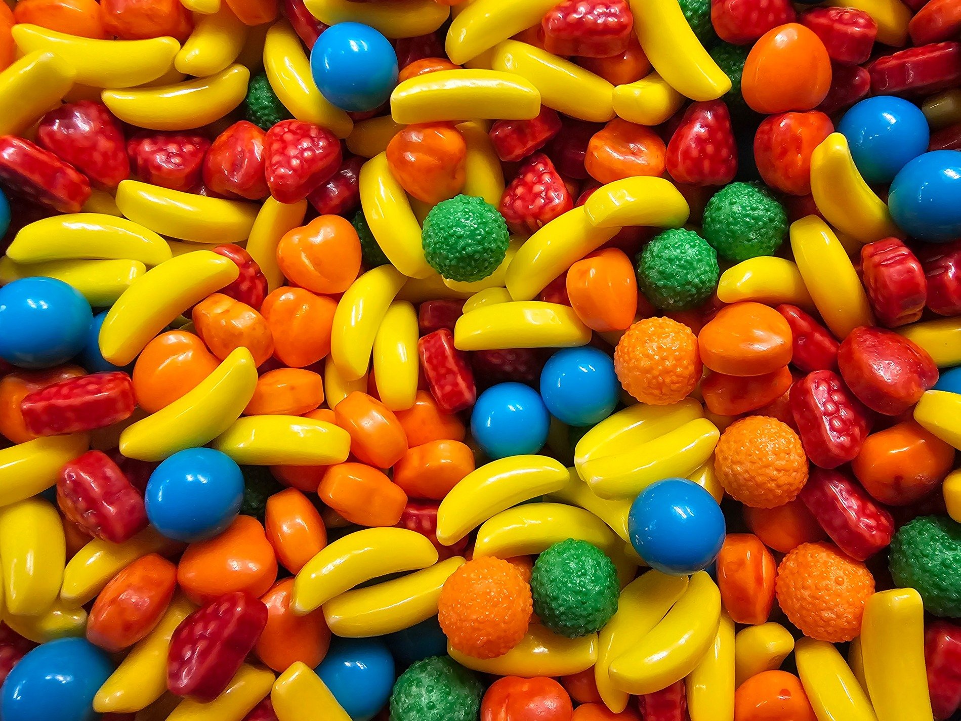 Bright forms nestle deep, sugar skin reflects the light, sweet curves meet the jar