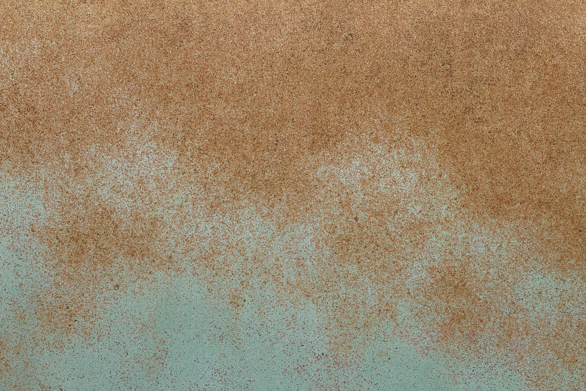 Brown mist meets the green, fine grains scatter on the skin, grit holds the surface