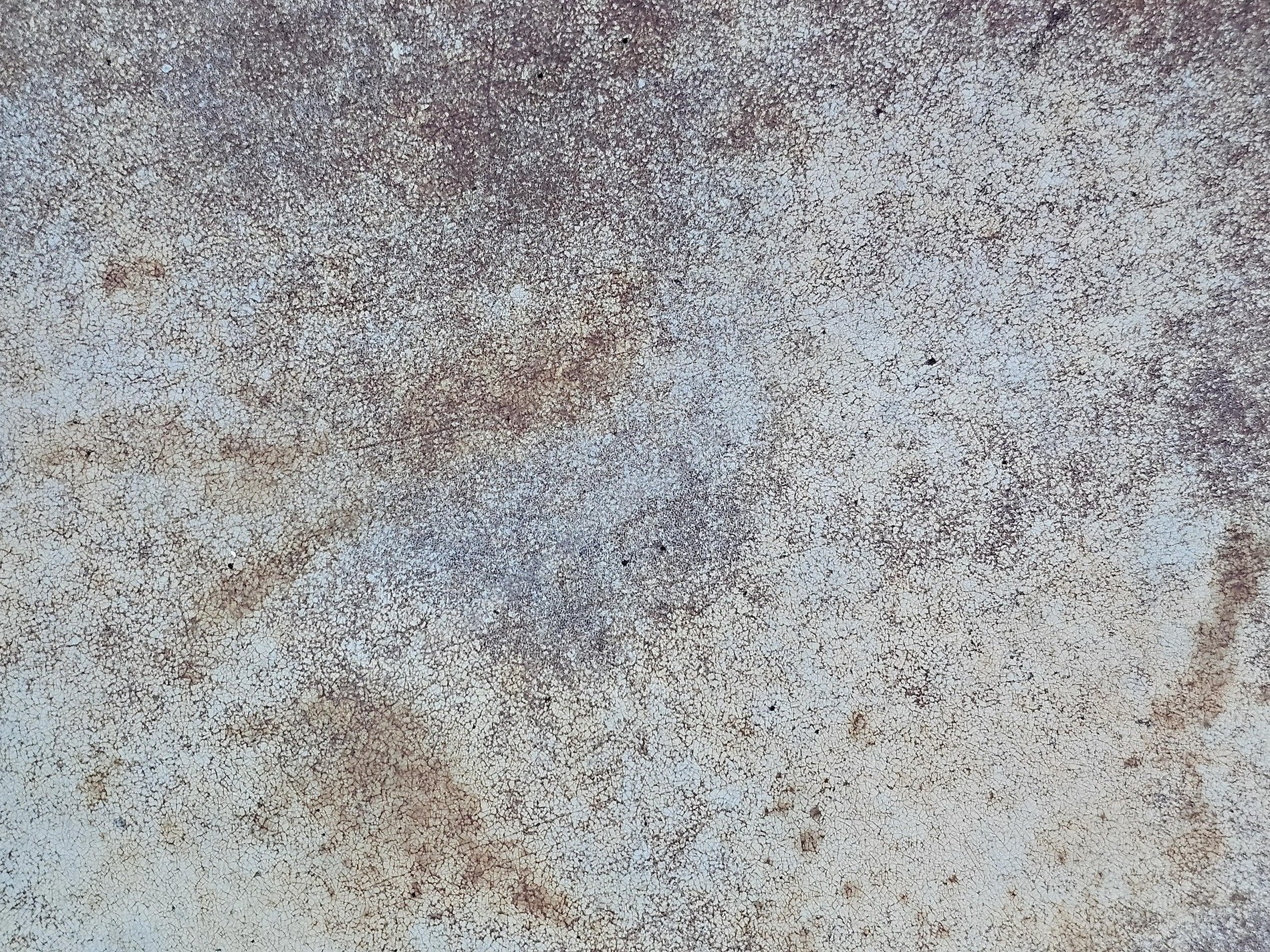 Fine cracks map the paint, rust bleeds through the ancient skin, time wears down the surface