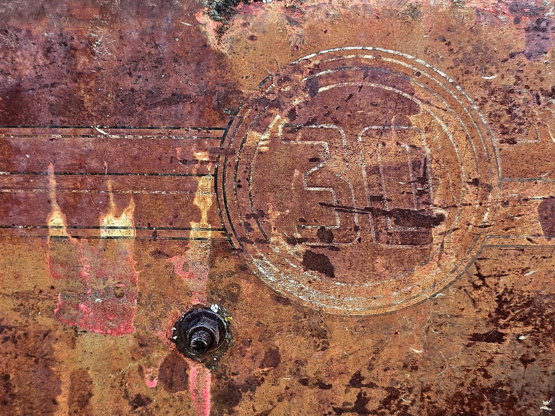 Faded thirty marks, heavy rust eats through the steel, orange claims the face