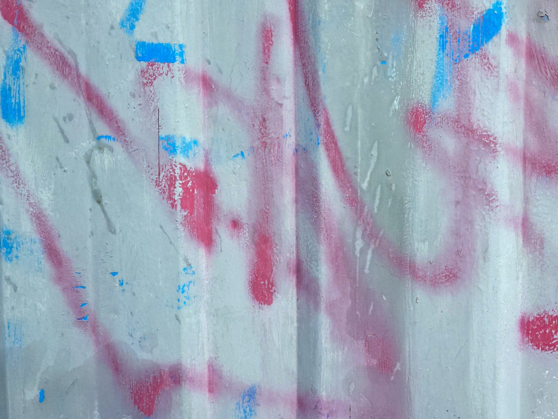 Grey stones in the mix, rough aggregate holds the grit, mineral flows deep