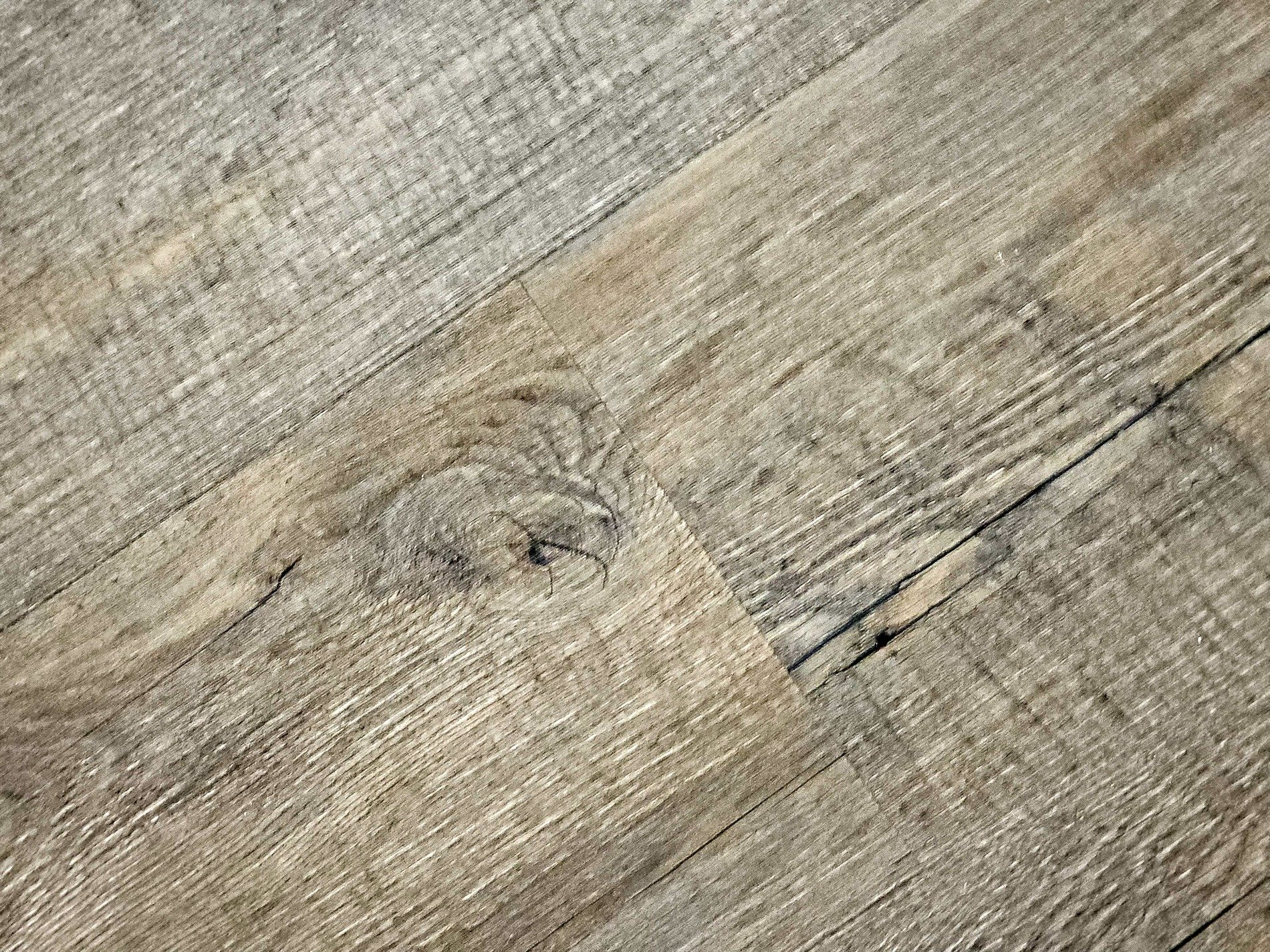 Grey stones in the mix, rough surface holds the grit, mineral flows deep