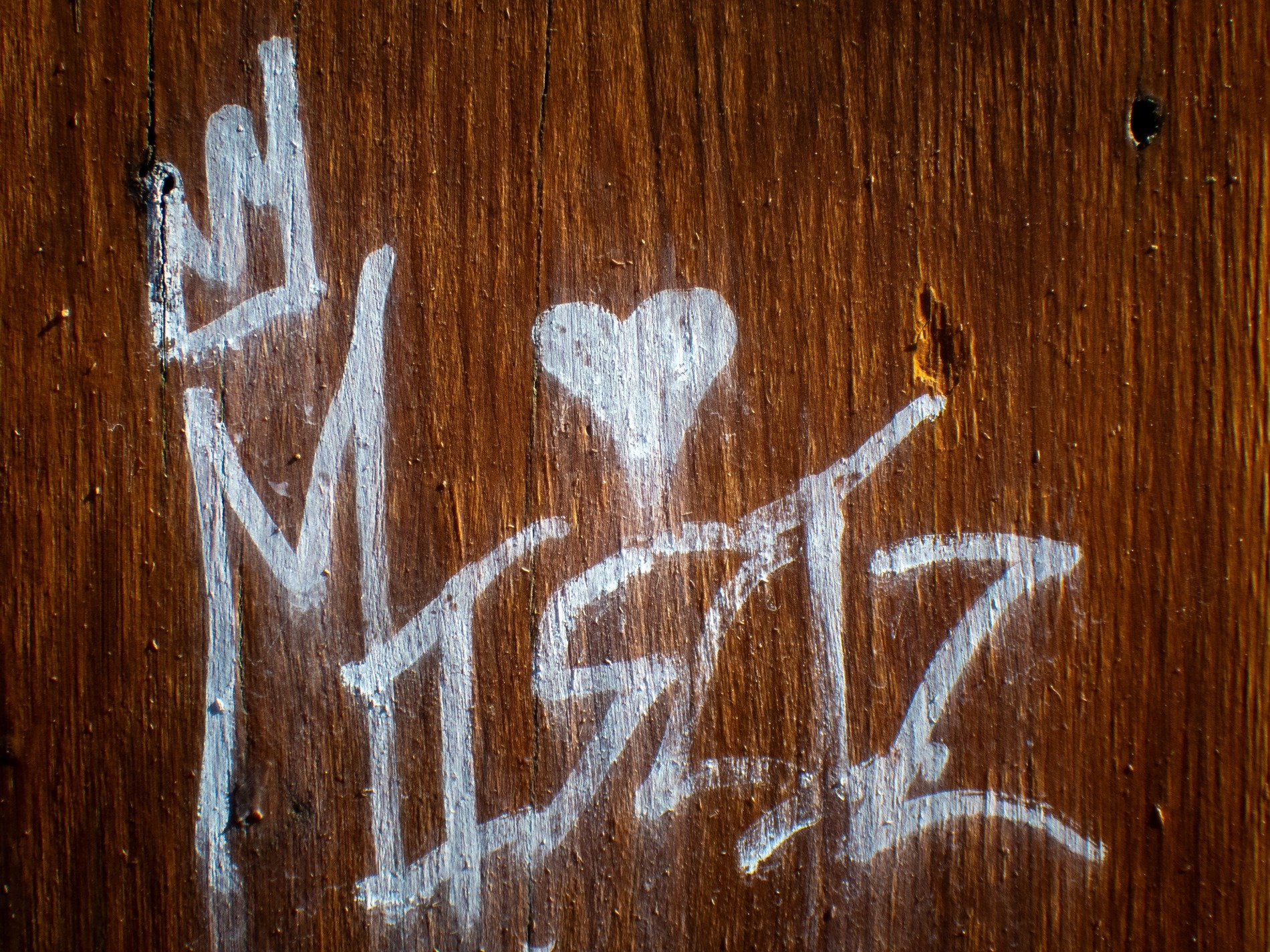 Orange grit holds fast, rough pits trace the heavy skin, time wears the finish