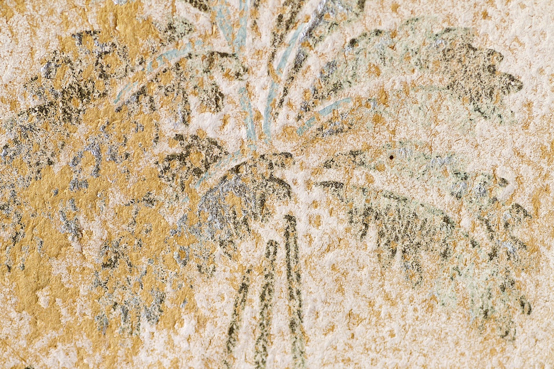 Orange scales crust deep, dark minerals bloom on the skin, earth returns to grit