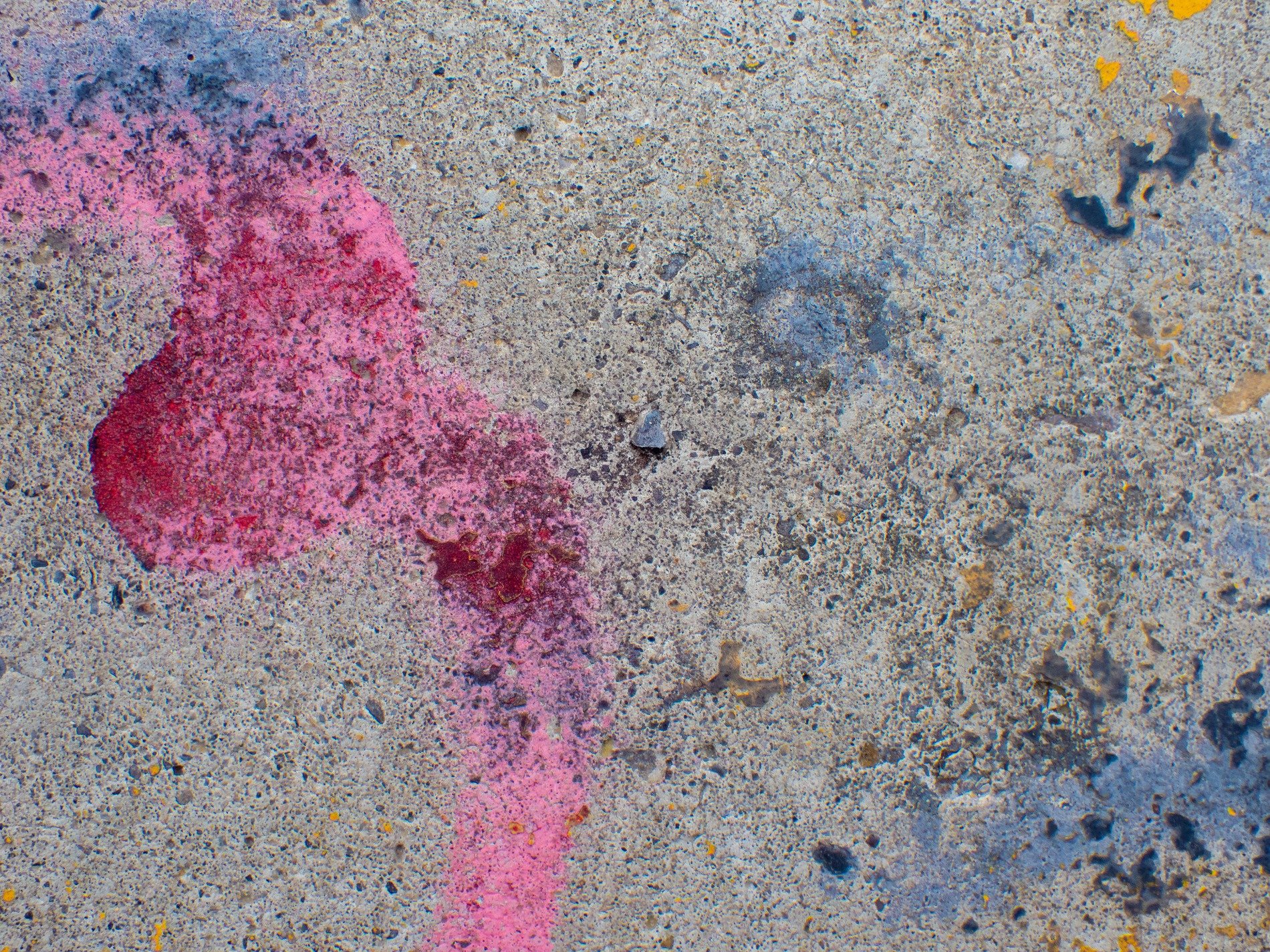 Pink mist meets the grey, jagged spots scatter on top, grit holds the splatter