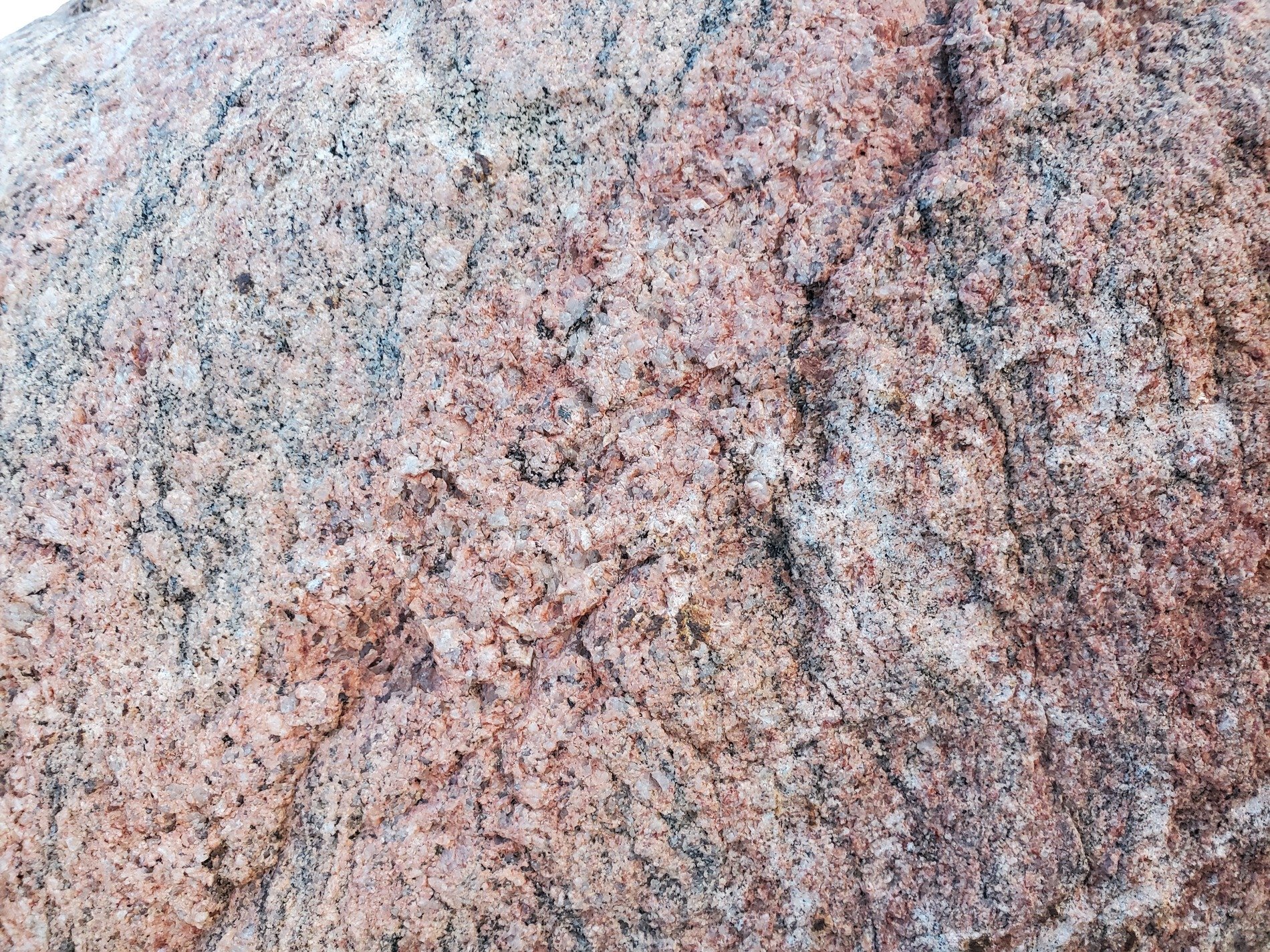 Purple hues meet the grey, jagged marks trace the field, grit holds the pattern