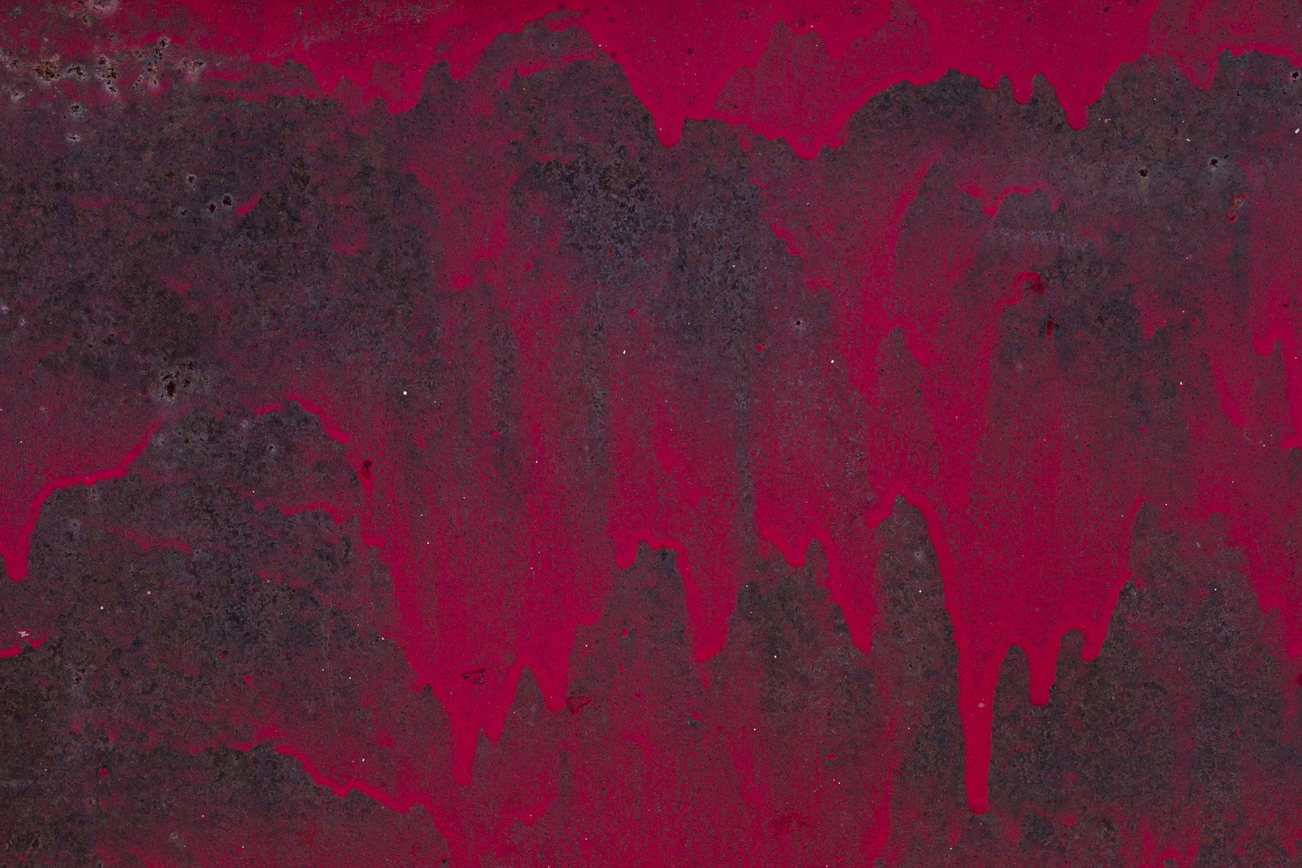 Red paint drips like blood, dark rust eats the heavy steel, time leaves a thick mark