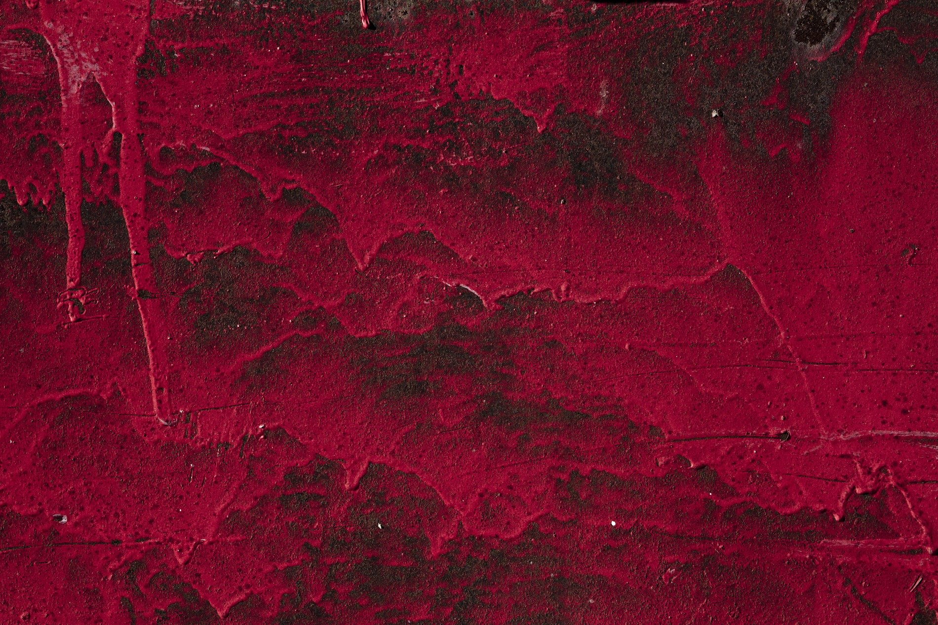 Crimson paint descends, dark iron stained deep with red, marks of heavy time