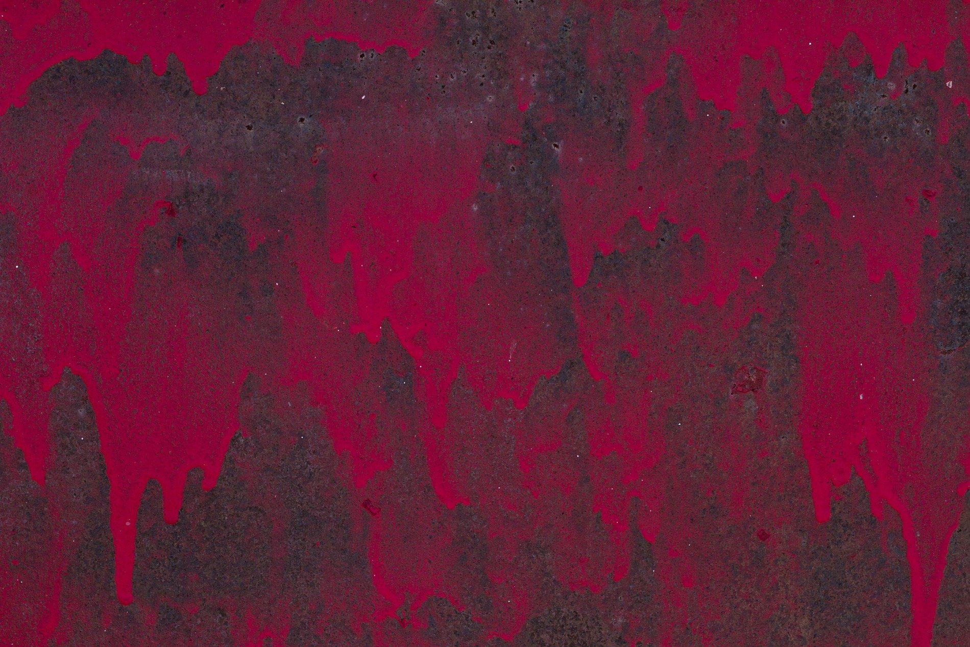 Red skin flakes away, orange grit holds the surface, time leaves a thick mark