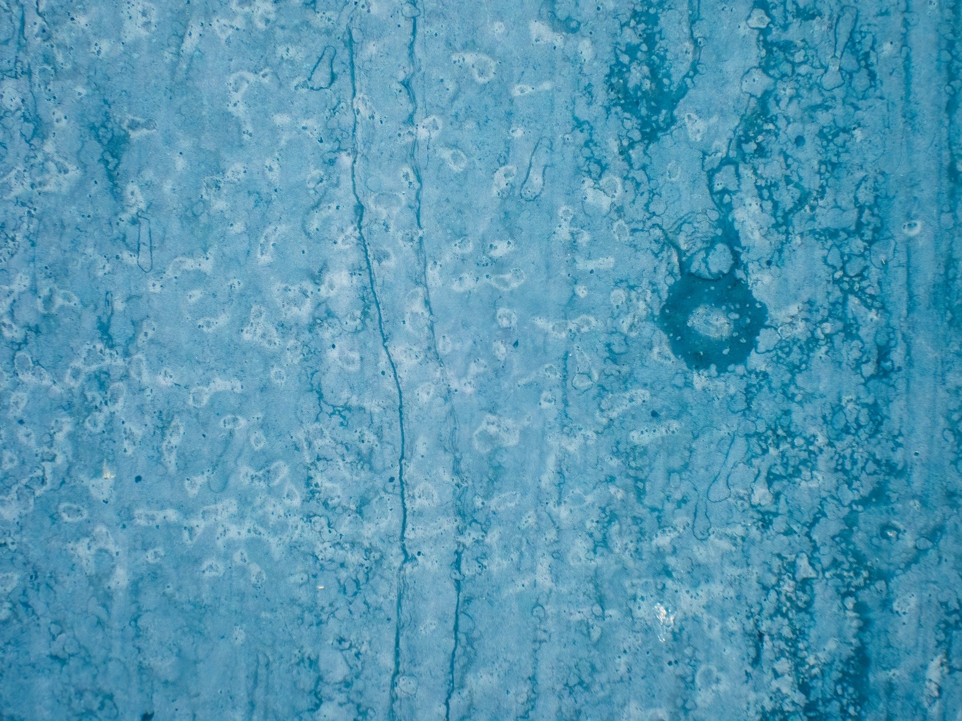 Red skin meets the rust, orange veins bleed on the skin, time leaves a thick mark