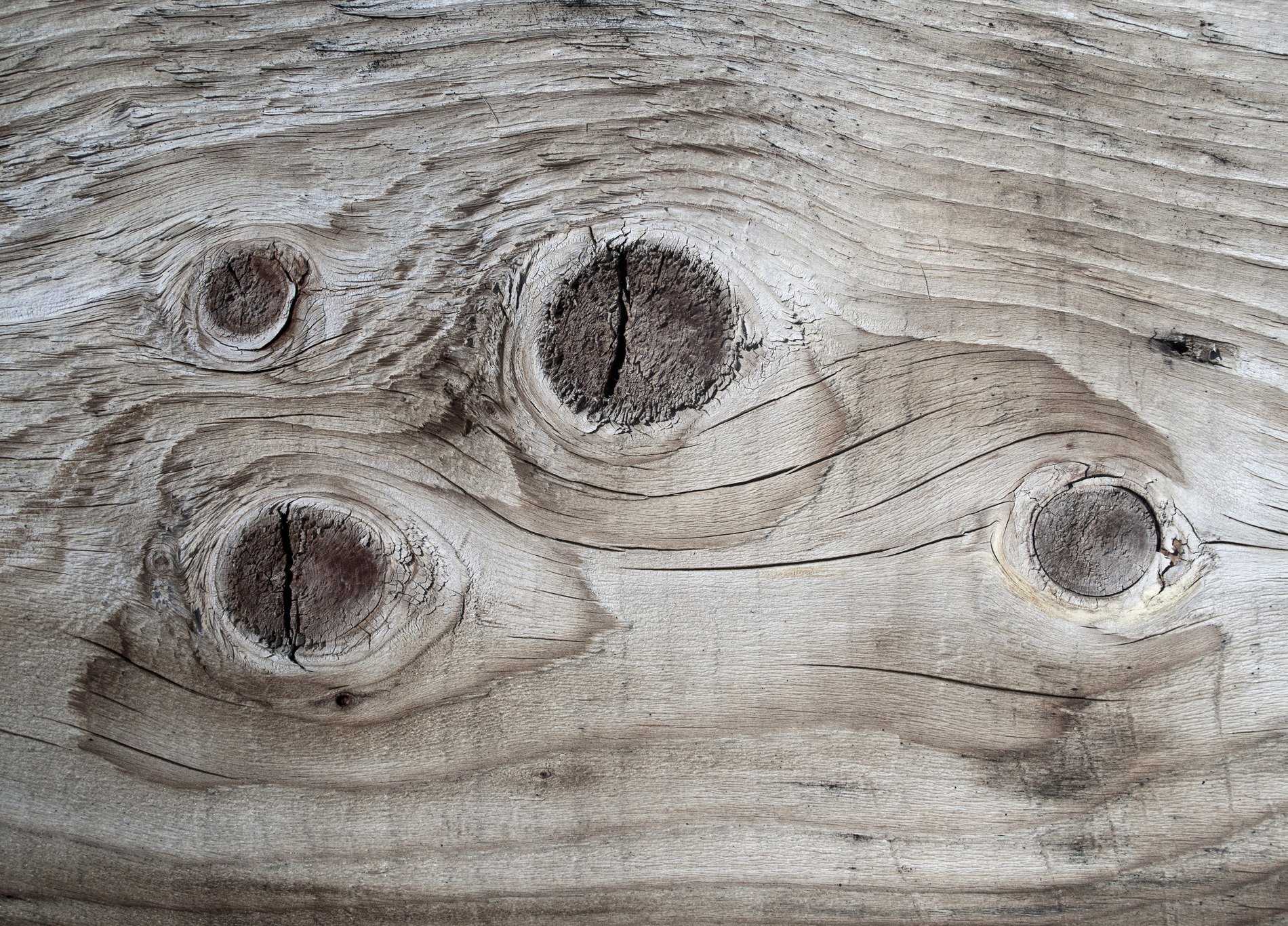 Silver grain flows fast, vertical lines trace the board, time wears the finish