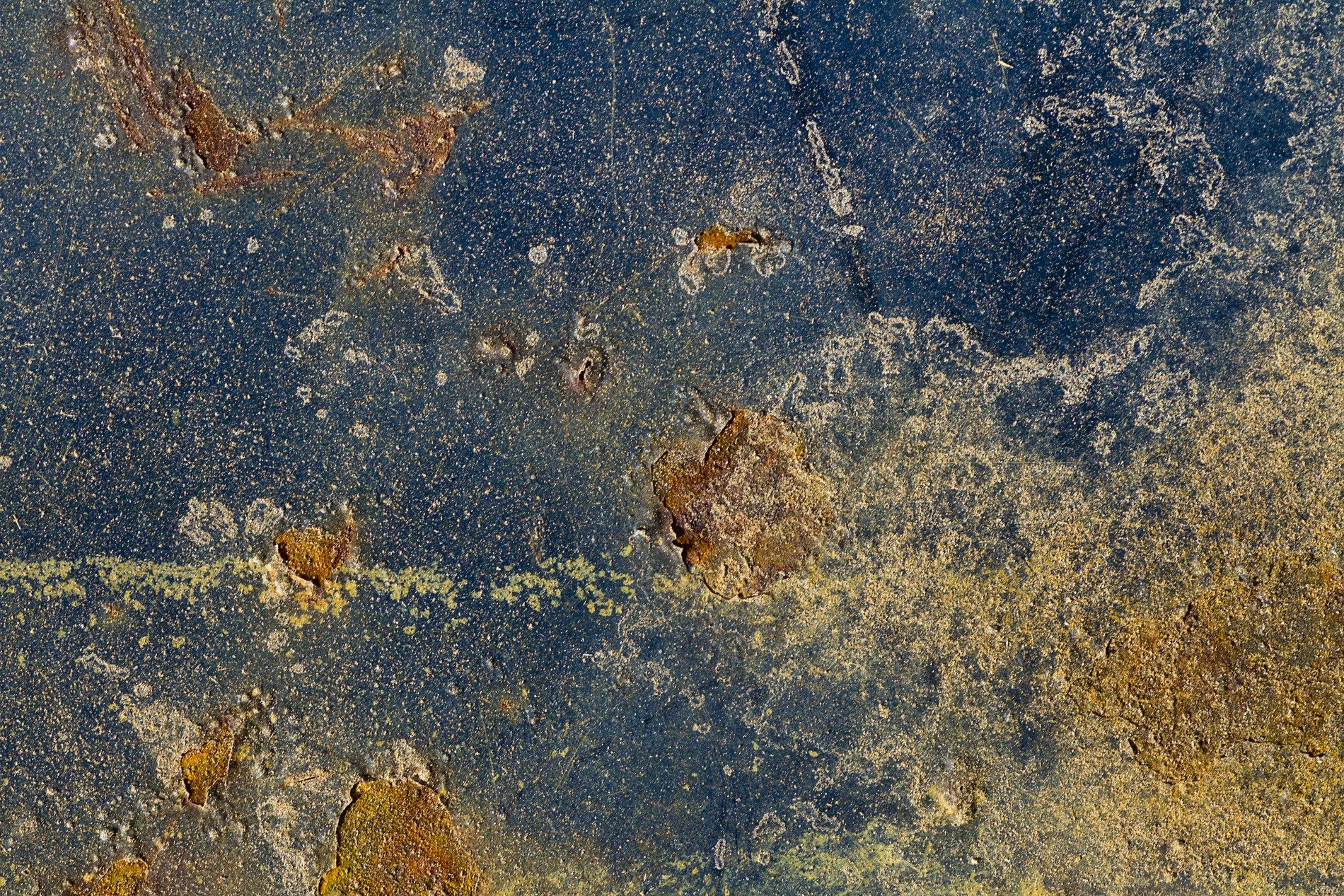 Dark paint starts to peel, orange rust eats through the steel, metal turns to dust