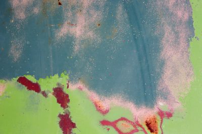 Blue fields meet the rust, orange veins bleed on the skin, time leaves a thick mark