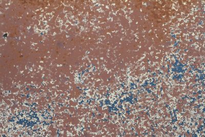 Red rust eats the steel, blue paint flakes like falling snow, time wears down the skin