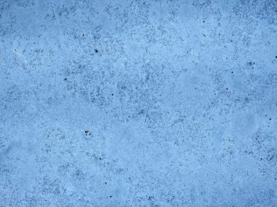 Blue flakes drift away, white layers show underneath, time wears down the skin