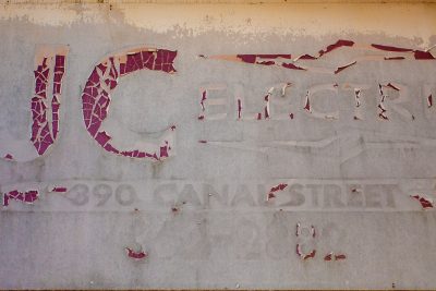 Blue mesh grid, fine synthetic fibers hold the pattern, light catches the weave