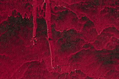 Blue paint bears the scars, orange rust spots mark the skin, grit holds the surface