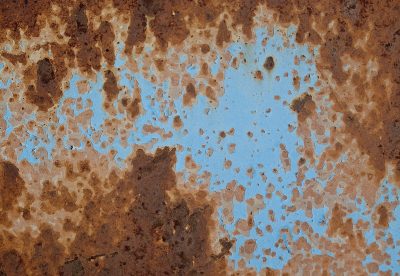 Iron turns to red, sky blue paint begins to peel, surface wastes away