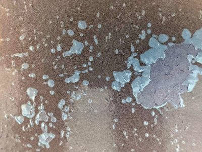 Blue spots on the skin, purple paint peels from the steel, road grime leaves a trail