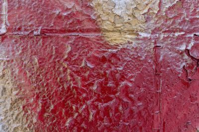 Blue spray on the grid, jagged letters meet the pattern, holes mark the field