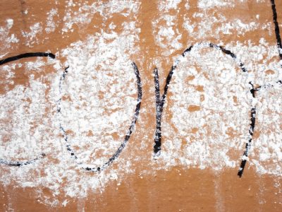 Blue streaks on the pane, white flakes meet the clear glass, time wears the coat