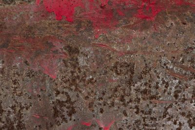 Crimson paint recedes, brown rust consumes the iron, time leaves heavy scars