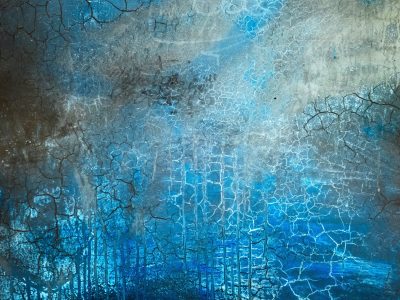 Clear streaks hold the light, jagged marks trace the surface, grit meets the shadow