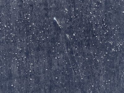 Dark sky of the ground, white stars etched in cold metal, scars mar the deep blue