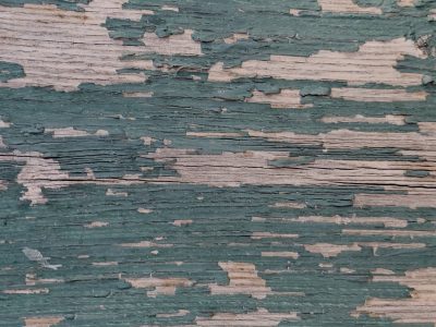 Dark knots hold the core, jagged fibers meet the light, grit marks the center