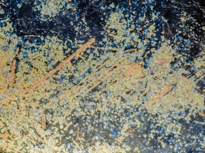 Gold flecks on the night, copper scratches through the dark, cosmos in the paint.