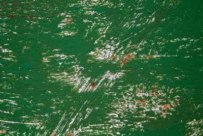 Green skin bears the scars, white and rust layers emerge, grit marks the finish