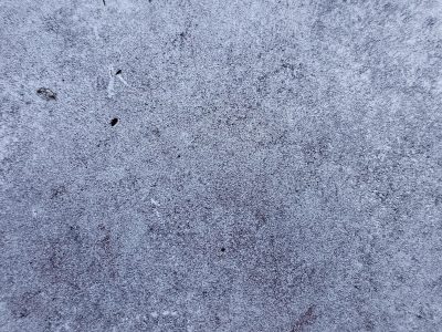 Frosted blue surface, icy grain across the plate, winter's cold embrace