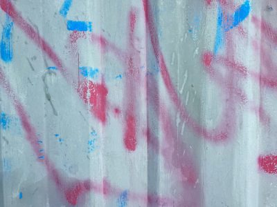 Grey stones in the mix, rough aggregate holds the grit, mineral flows deep