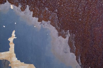 Orange rust takes all, heavy scales crust on the skin, earth returns to grit