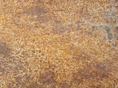 Orange rust takes all, heavy scales crust on the steel, earth returns to grit