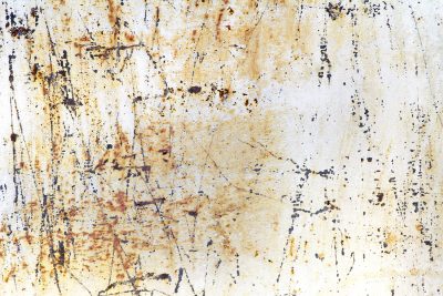 Scars mar the white paint, orange rust bleeds through the cracks, time claims the cold steel