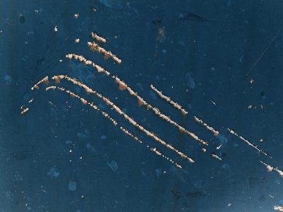 Orange rust takes all, red paint fades to heavy brown, steel turns into grit