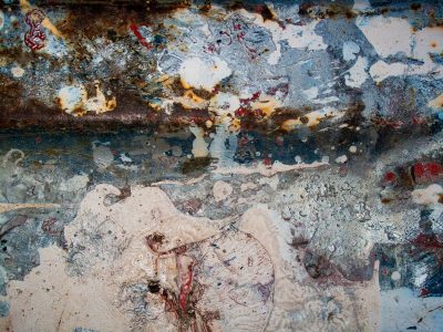 Pink floral wallpaper, faded roses on cream paper, pattern holds the age