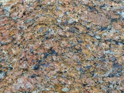 Red crystals emerge, black veins cut through orange dust, stone flows like a map