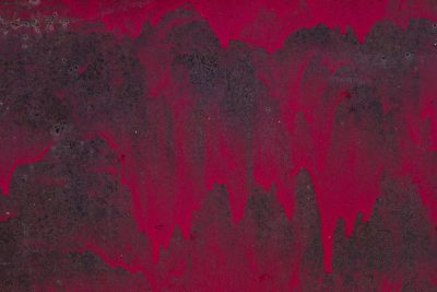 Red paint drips like blood, dark rust eats the heavy steel, time leaves a thick mark