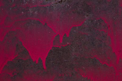 Red paint starts to run, rusted metal eats the edge, shadows bleed away